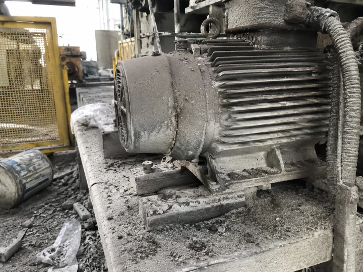 Dusty machinery in messy workshop